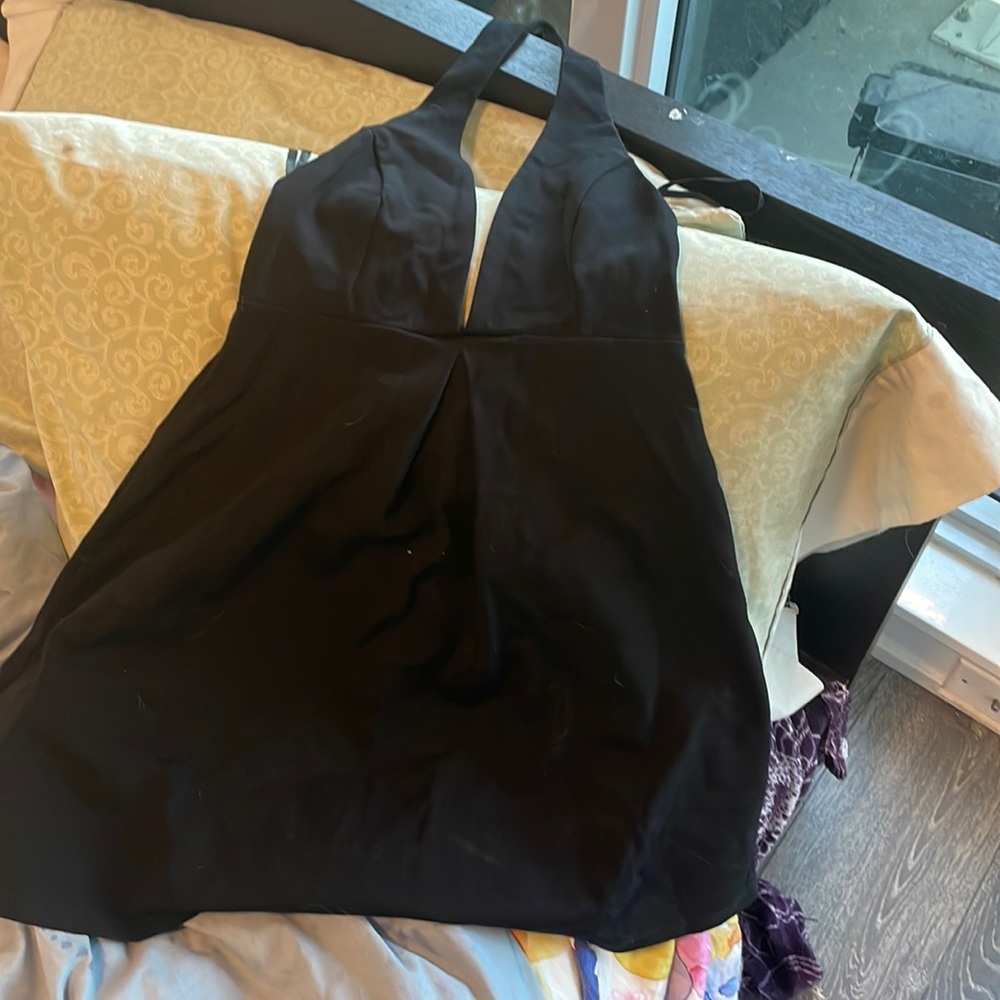 Halter black dress from urban outfitters, never worn without tags